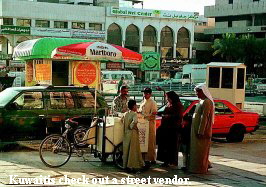 Kuwaitis check out a street vendor.